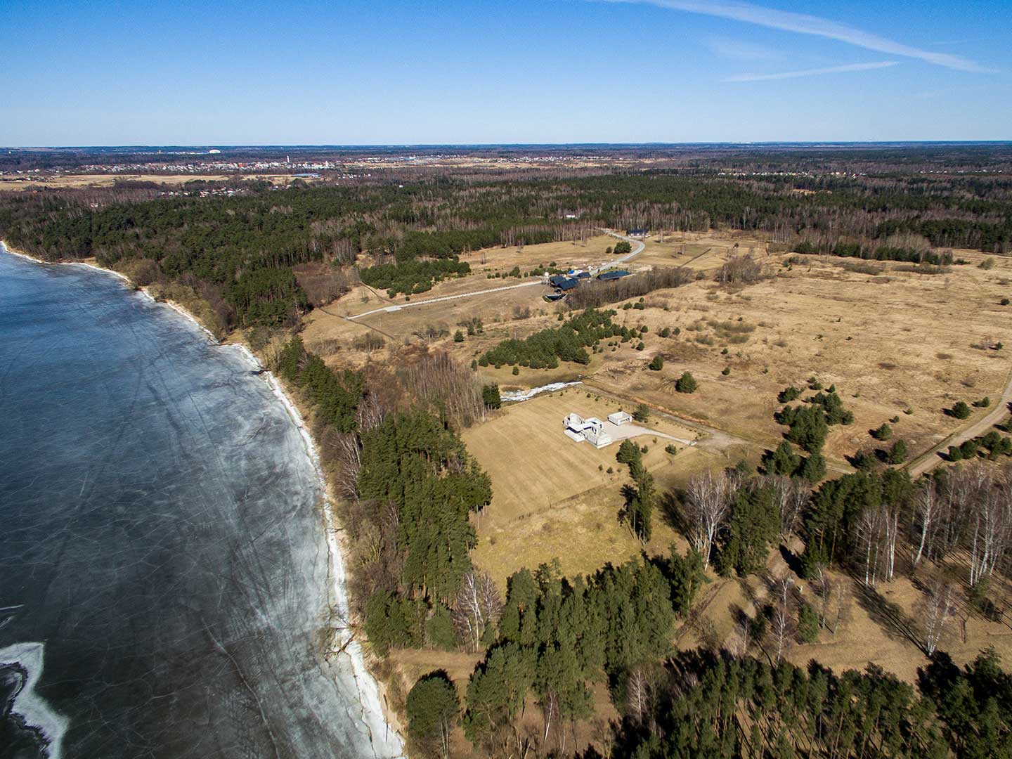 Agrokoncernas’ mysterious construction project stands surrounded by forest on the shores of the Kaunas Reservoir, the largest lake in Lithuania. Credit: Lukas Balandis / 15min