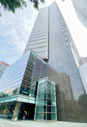 A tall glass and metal skyscraper.