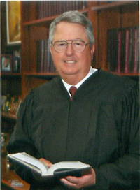 US District Judge Sam Sparks, who the men intended to bribe.